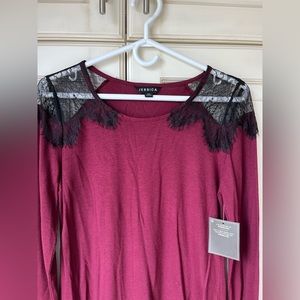 NWT Jessica long sleeve jersey top with lace details. Size medium.